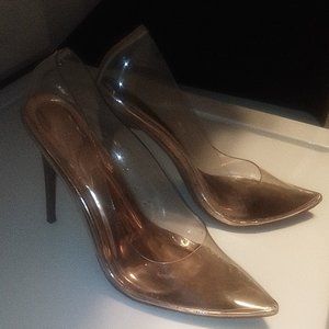 Never worn 4 inch clear and gold heels.